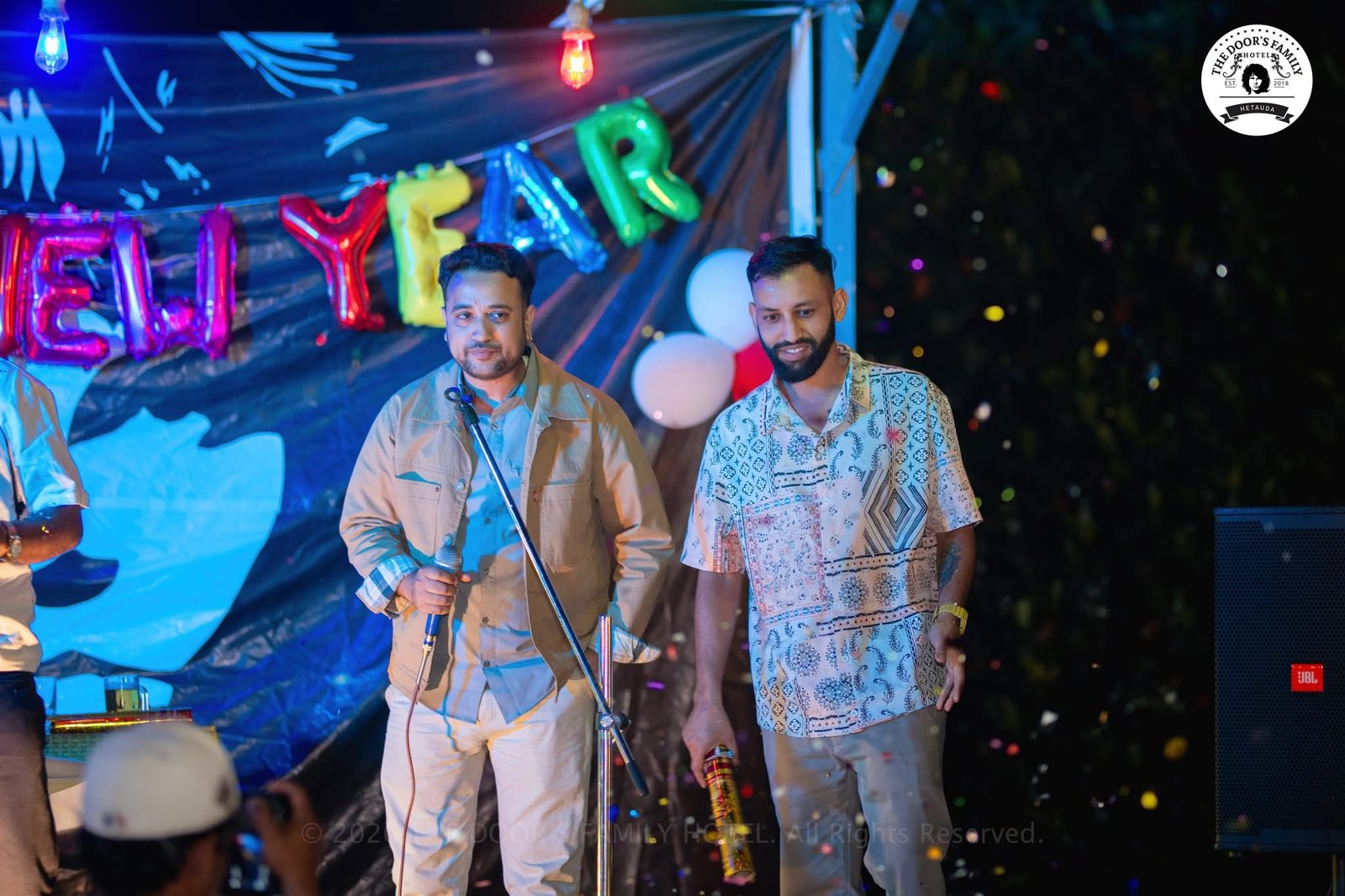 Hosts on the celebration stage